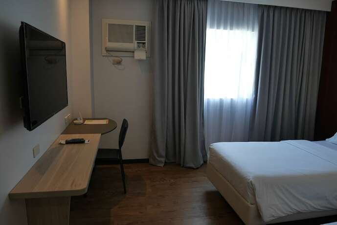 Imagen de la habitación del Hotel Circle Inn And Suites Bacolod. Foto 21