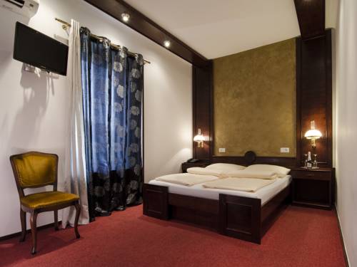 Imagen de la habitación del Hotel Cirman Rooms. Foto 10