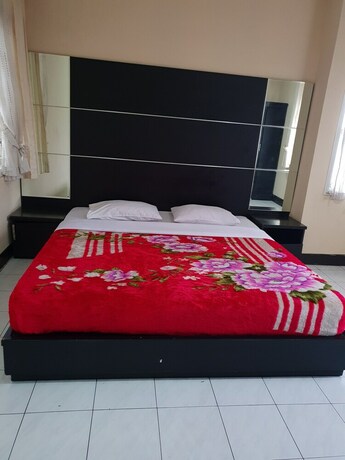 Imagen de la habitación del Hotel Cisarua Indah Cottage. Foto 21