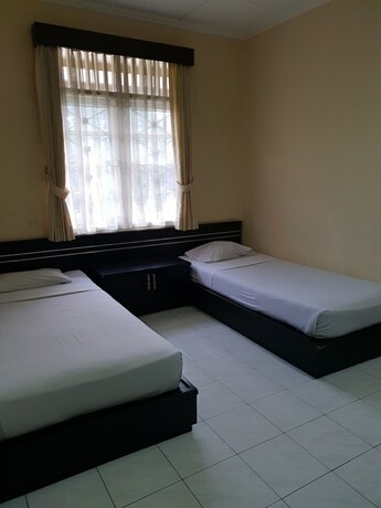 Imagen de la habitación del Hotel Cisarua Indah Cottage. Foto 23