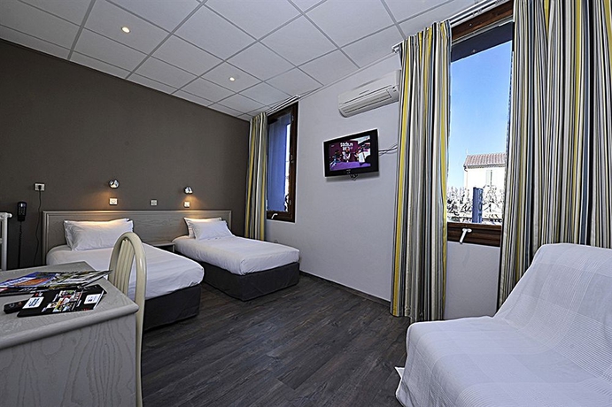 Imagen de la habitación del Hotel Cit'Hotel le Louvre. Foto 9