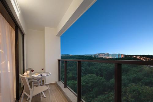 Imagen de la habitación del Hotel Citadines Hope City Boao. Foto 13