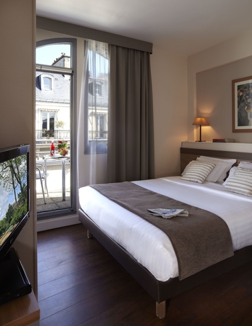 Imagen de la habitación del Hotel Citadines Trocadéro Paris. Foto 8