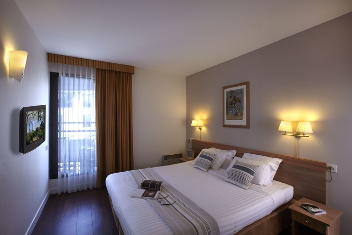 Imagen de la habitación del Hotel Citadines Trocadéro Paris. Foto 9