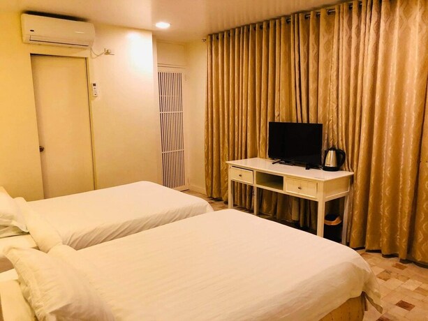 Imagen de la habitación del Hotel Citi Garden Suites. Foto 24