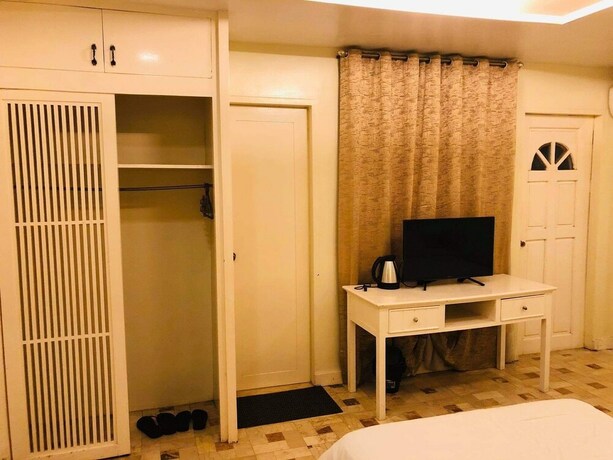 Imagen de la habitación del Hotel Citi Garden Suites. Foto 26