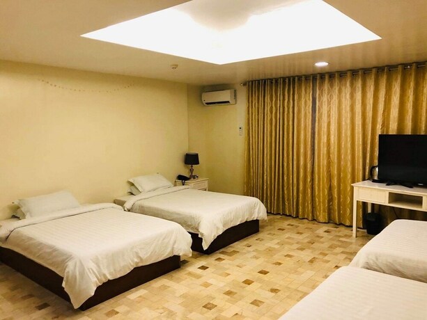 Imagen de la habitación del Hotel Citi Garden Suites. Foto 27