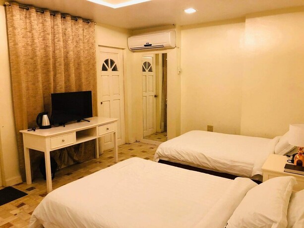 Imagen de la habitación del Hotel Citi Garden Suites. Foto 28
