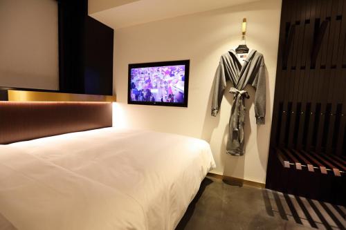 Imagen de la habitación del Hotel Citigo Jingan Shanghai. Foto 6