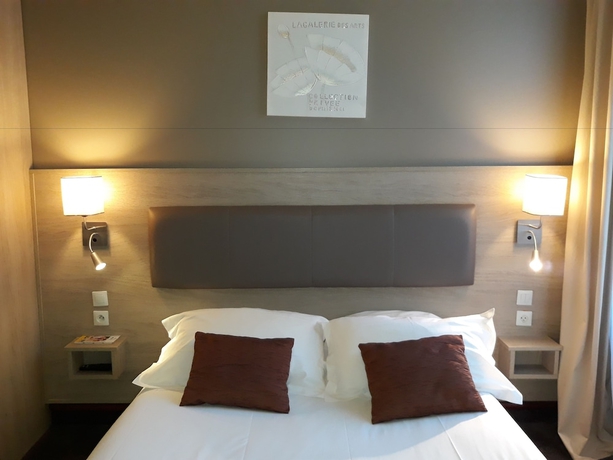 Imagen de la habitación del Hotel Citotel Le Challonge. Foto 15