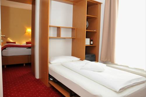 Imagen de la habitación del Hotel City Am Wasserturm. Foto 8