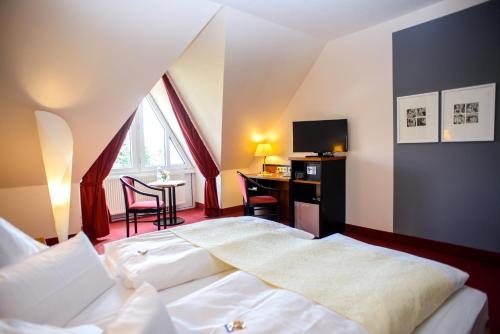 Imagen de la habitación del Hotel City Aschersleben. Foto 6