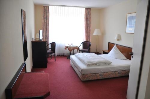 Imagen de la habitación del Hotel City Aschersleben. Foto 7
