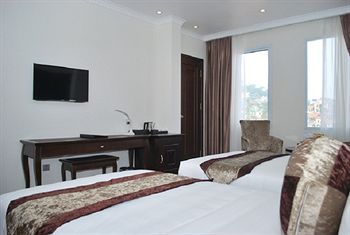 Imagen de la habitación del Hotel City Bay Palace. Foto 9