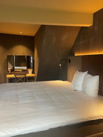 Imagen de la habitación del Hotel City Center Lodge Utrecht. Foto 17