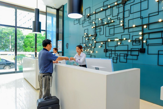 Imagen de la habitación del Hotel City Comfort Inn Maoming Railway Station Wenming R. Foto 5