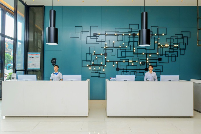 Imagen de la habitación del Hotel City Comfort Inn Maoming Railway Station Wenming R. Foto 6