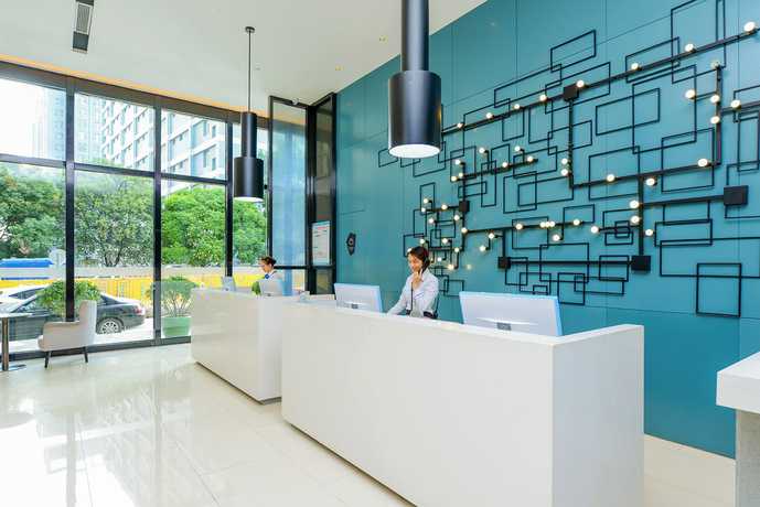 Imagen de la habitación del Hotel City Comfort Inn Maoming Railway Station Wenming R. Foto 7