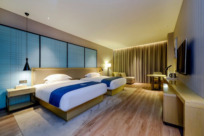 Imagen de los interiores del Hotel City Comfort Inn Maoming Railway Station Wenming R. Foto 16