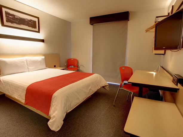 Imagen de la habitación del Hotel City Express By Marriott Cancun. Foto 6