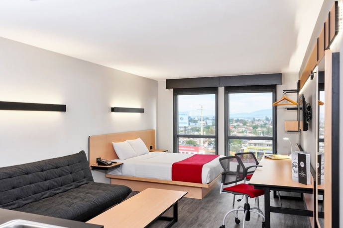 Imagen de la habitación del Hotel City Express By Marriott Guadalajara Aeropuerto. Foto 12