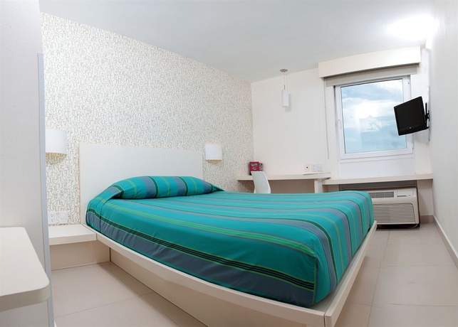 Imagen de la habitación del Hotel City Express Junior By Marriott Cancun. Foto 4