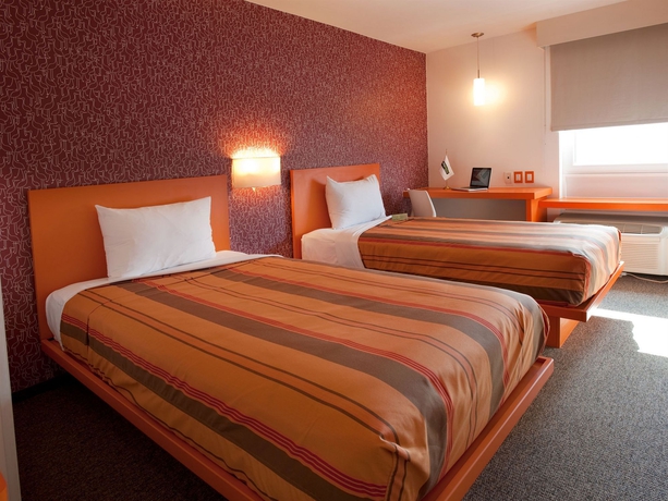 Imagen de la habitación del Hotel City Express Junior By Marriott Guadalajara Periférico Sur. Foto 11