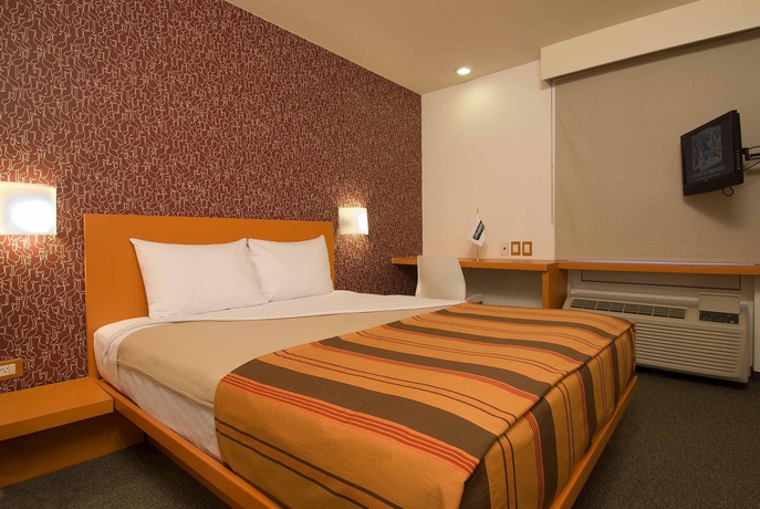 Imagen de la habitación del Hotel City Express Junior By Marriott Mexicali. Foto 5