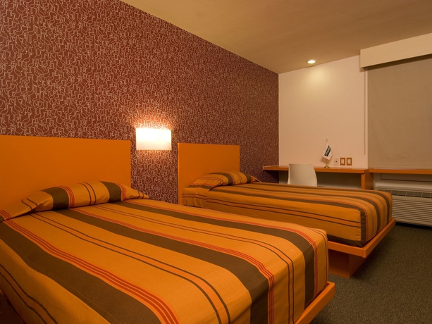 Imagen de la habitación del Hotel City Express Junior By Marriott Mexicali. Foto 7