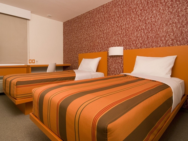 Imagen de la habitación del Hotel City Express Junior By Marriott Toluca Aeropuerto. Foto 11