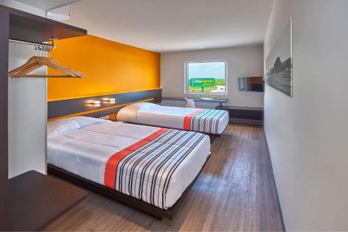 Imagen de la habitación del Hotel City Express Junior By Marriott Tuxtepec. Foto 13