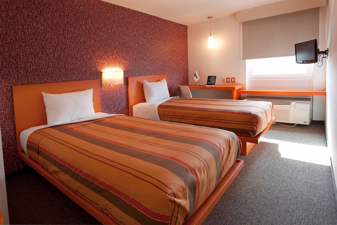 Imagen de la habitación del Hotel City Express Junior Tuxtla Gutiérrez Poliforum. Foto 10