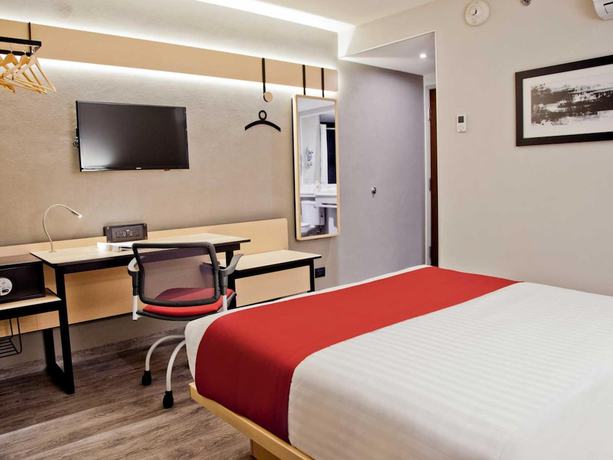 Imagen de la habitación del Hotel City Express Plus Medellin. Foto 10