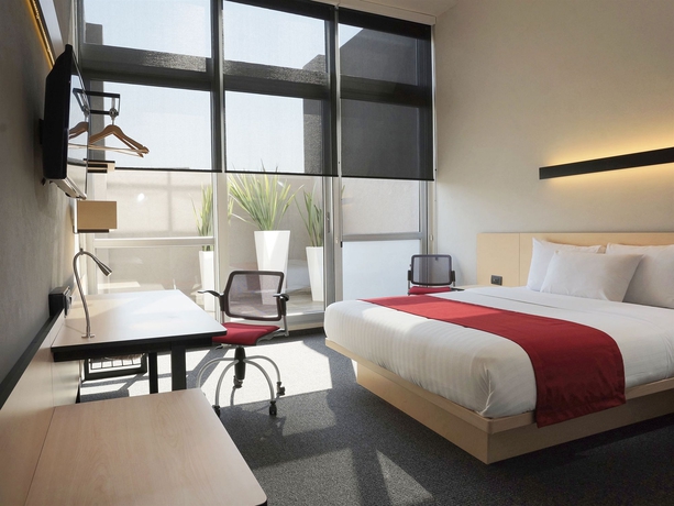 Imagen de la habitación del Hotel City Express Plus Patio Universidad. Foto 4