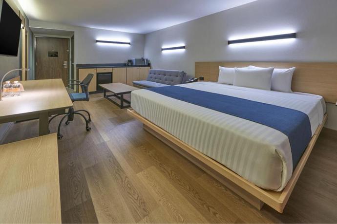 Imagen de la habitación del Hotel City Express by Marriott Cancun Aeropuerto. Foto 2