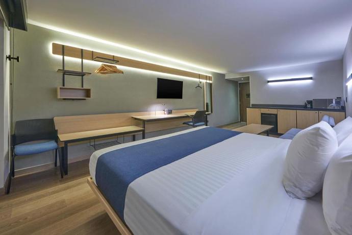 Imagen de la habitación del Hotel City Express by Marriott Cancun Aeropuerto. Foto 3