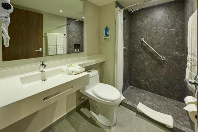 Imagen de la habitación del Hotel City Express by Marriott Cancun Aeropuerto. Foto 4