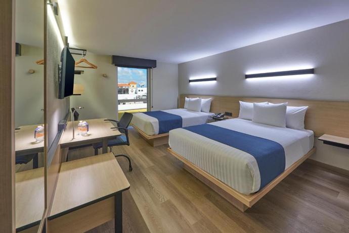 Imagen de la habitación del Hotel City Express by Marriott Cancun Aeropuerto. Foto 5