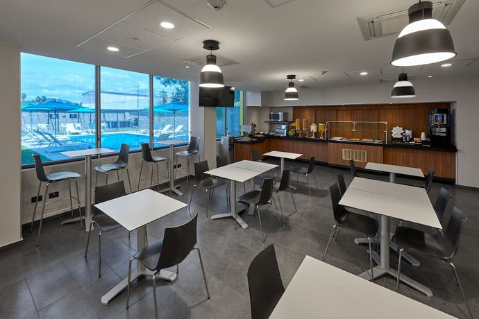 Imagen del bar/restaurante del Hotel City Express by Marriott Hermosillo Expo. Foto 4