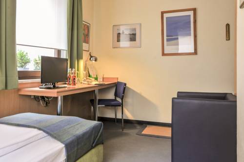 Imagen de la habitación del Hotel City Fellbach. Foto 11