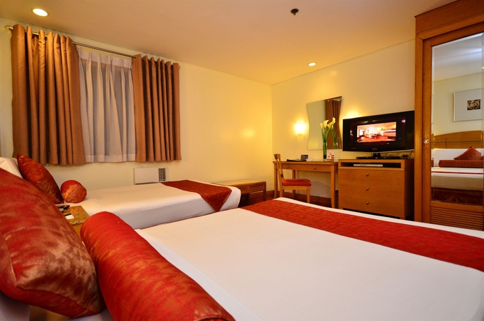 Imagen de la habitación del Hotel City Garden Suites Manila. Foto 11