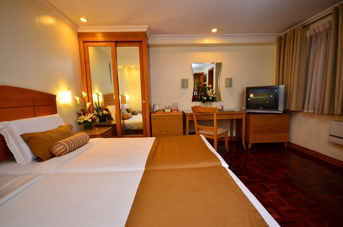 Imagen de la habitación del Hotel City Garden Suites Manila. Foto 12