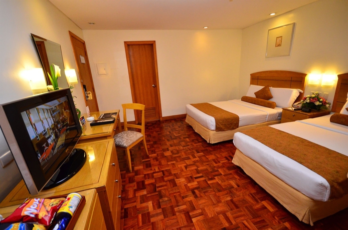 Imagen de la habitación del Hotel City Garden Suites Manila. Foto 14