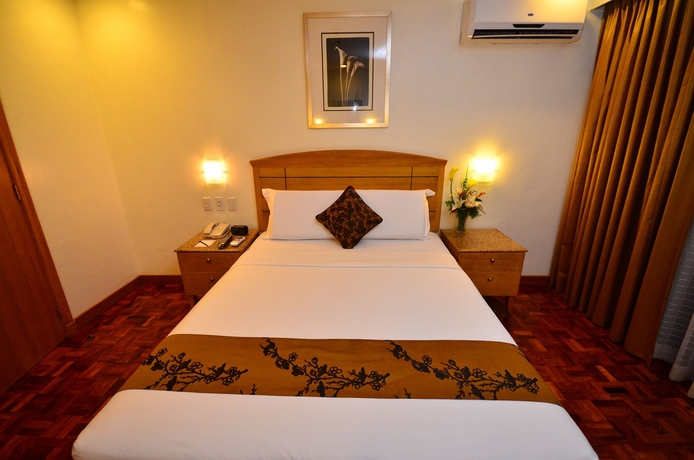 Imagen de la habitación del Hotel City Garden Suites Manila. Foto 16