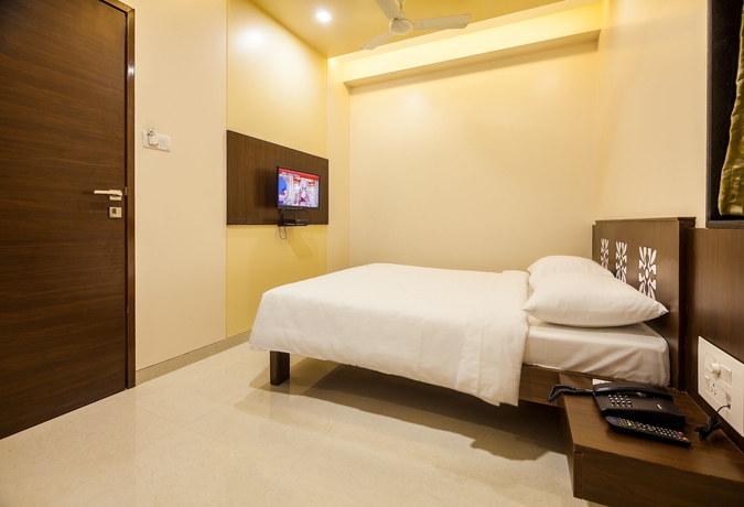 Imagen de la habitación del Hotel City Guest House, Mumbai. Foto 5