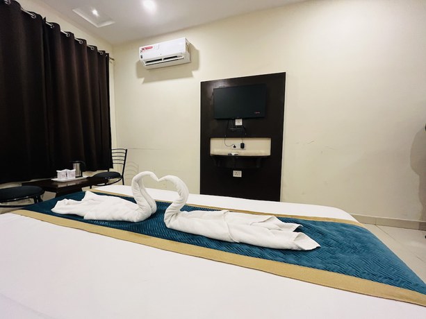 Imagen de la habitación del Hotel City Heritage Haridwar. Foto 8