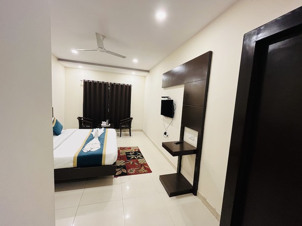 Imagen de la habitación del Hotel City Heritage Haridwar. Foto 13