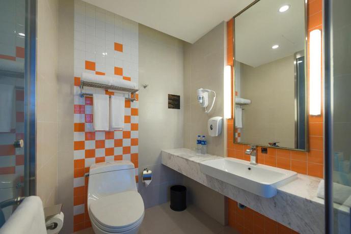 Imagen de la habitación del Hotel City Holiday Guangzhou Baiyun Airport. Foto 11