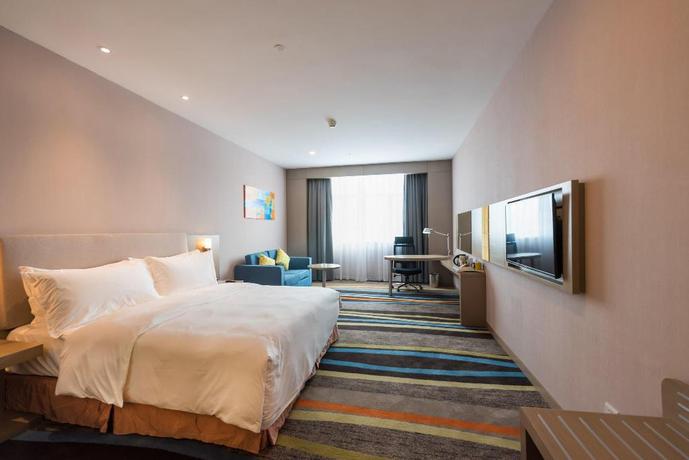 Imagen de la habitación del Hotel City Holiday Guangzhou Baiyun Airport. Foto 12