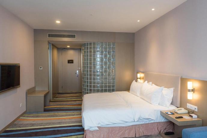 Imagen de la habitación del Hotel City Holiday Guangzhou Baiyun Airport. Foto 13